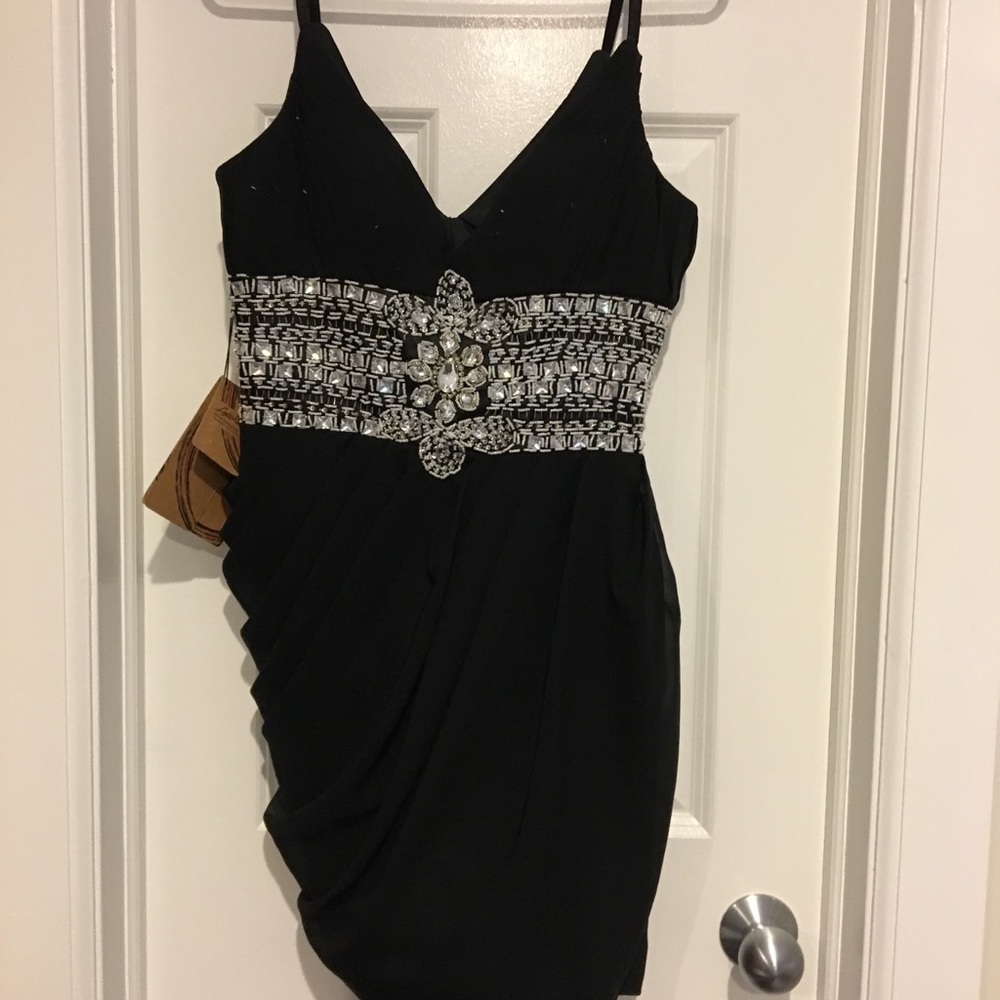 New w tags stunning Asymmetrical black party dress. Super sexy size 8